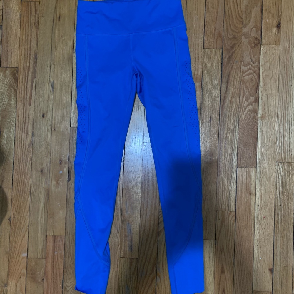 Under Armor, electric blue leggings.